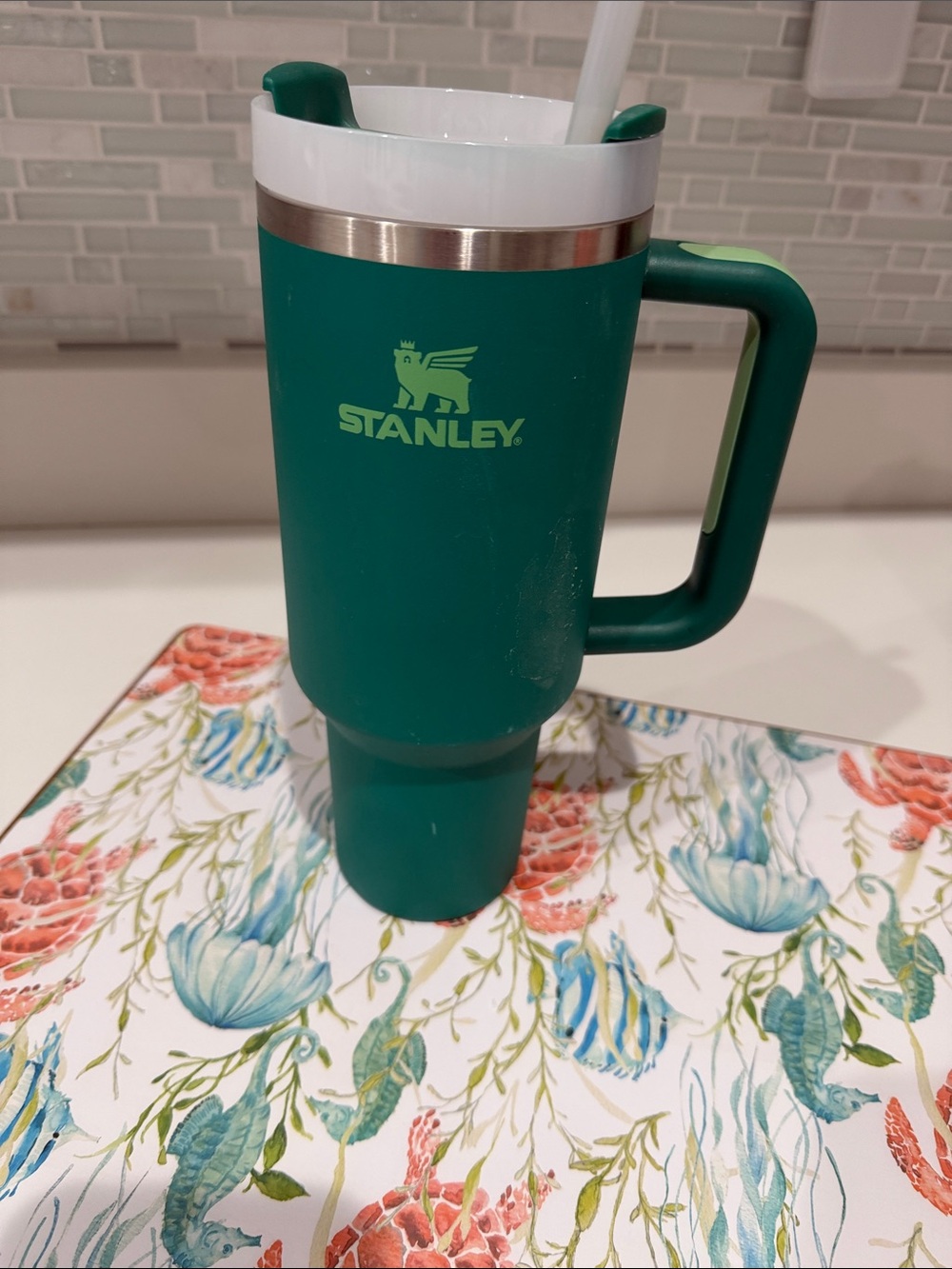 Stanley Green Travel Tumbler with Handle and White Rim